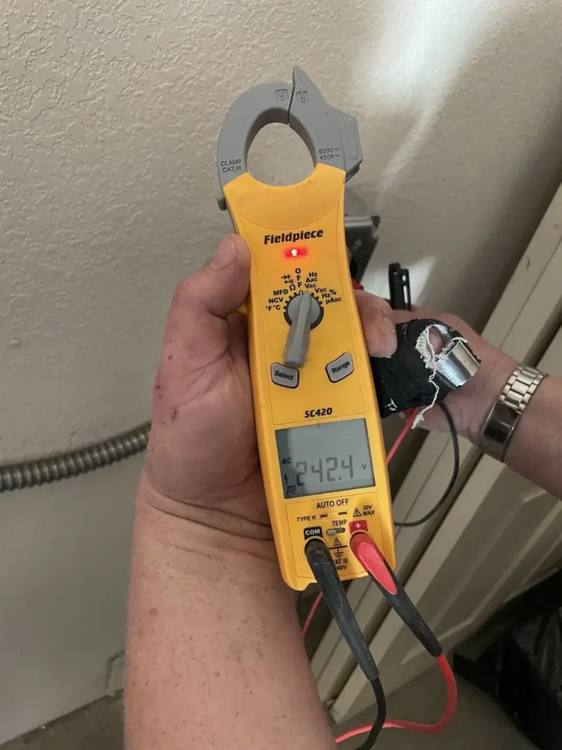 Voltage testing with clamp meter during Ceiling Fan Installation in Belmont